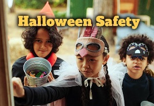Halloween Safety with three children trick or treating in the distance.